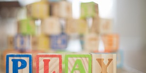 Wooden blocks that spell out PLAY